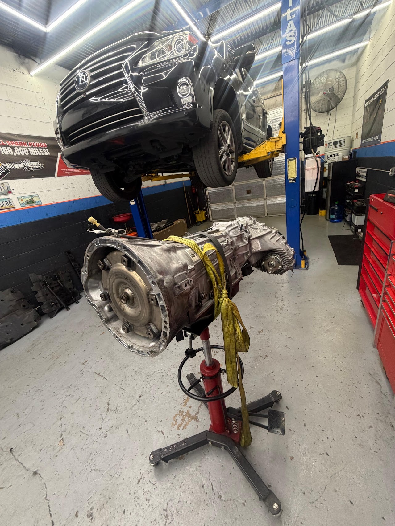 Vehicle on the lift with transmission being serviced at Rubens Auto Service